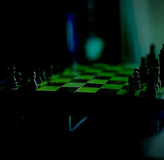 A dimly lit chess board with pieces set up for a game. The focus is on the board, which features a checkerboard pattern. The lighting casts shadows and gives the setting a mysterious effect, highlighting the pieces' silhouettes.